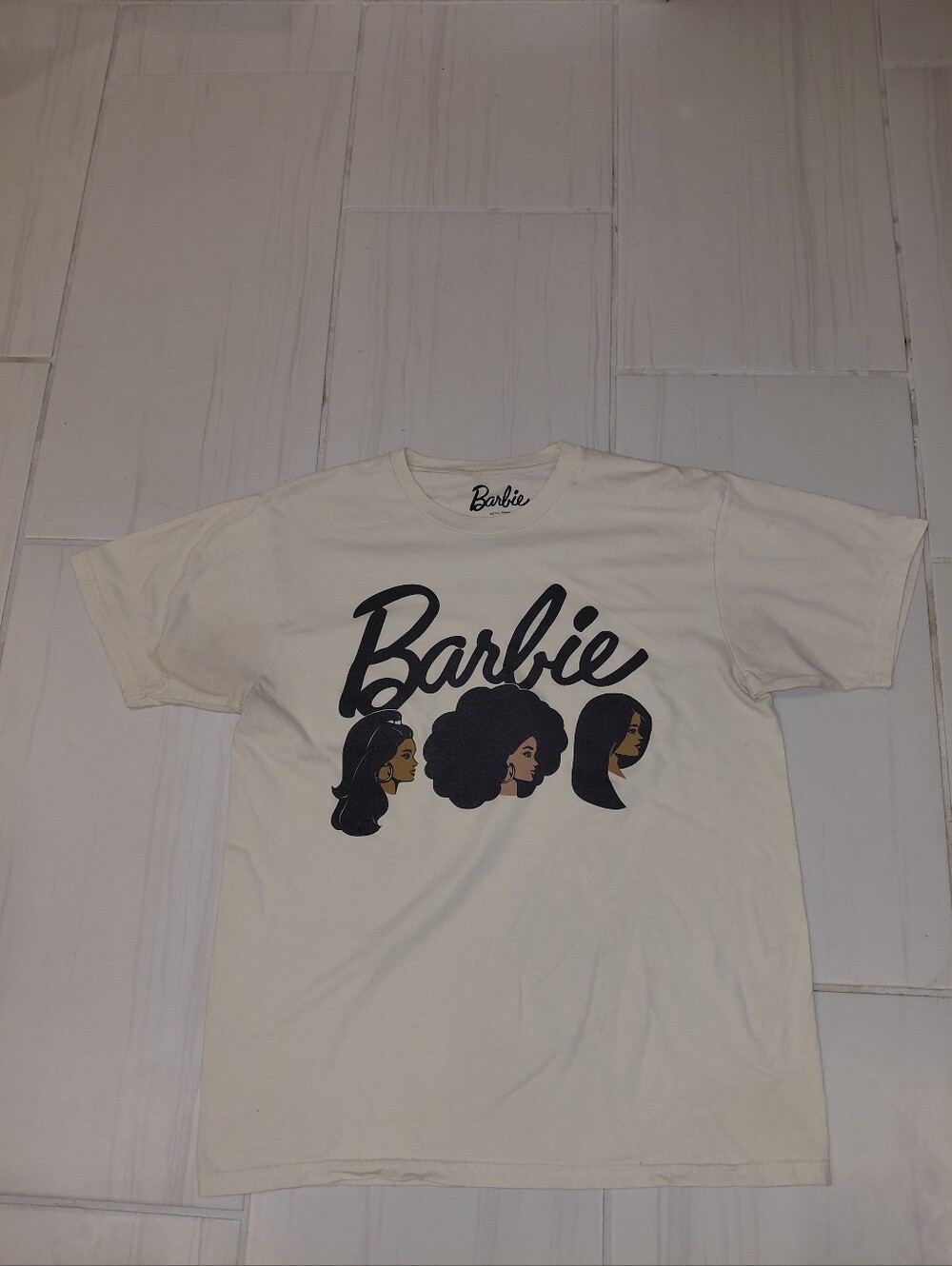 Barbie Cream Graphic Tee with Black Script and Multitone Faces